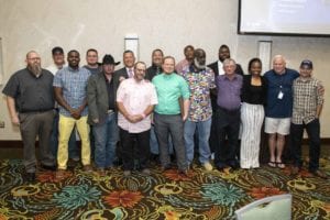 A group of Prime Inc. truck driving instructors posing for a picture at the Top Instructor and Trainer banquet.